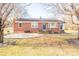 Brick ranch house with landscaped yard and stone walkway at 1750 Melrose Dr, Shelby, NC 28152