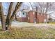 Brick house with a sunroom and mature trees in the yard at 1750 Melrose Dr, Shelby, NC 28152