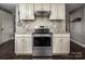 Kitchen with granite countertops and stainless steel range at 1750 Melrose Dr, Shelby, NC 28152