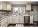 Clean kitchen with granite countertops, white cabinets, and stainless steel sink at 1750 Melrose Dr, Shelby, NC 28152