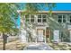 Front view of house with green siding and two doors at 1754 J Julian Ln, Charlotte, NC 28208