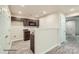 Modern galley kitchen with dark brown cabinets and granite countertops at 1758 J Julian Ln, Charlotte, NC 28208