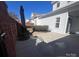 Spacious back patio with brick wall and gate at 20215 Middletown Rd, Cornelius, NC 28031