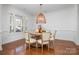 Formal dining room featuring a round table and hardwood floors at 20215 Middletown Rd, Cornelius, NC 28031