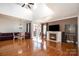 Spacious living room featuring a fireplace and hardwood floors at 20215 Middletown Rd, Cornelius, NC 28031