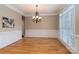 Bright dining room with hardwood floors and chandelier at 205 Micah Ln # 33, Iron Station, NC 28080