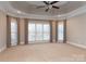 Main bedroom featuring a tray ceiling and ample natural light at 205 Micah Ln # 33, Iron Station, NC 28080