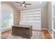 Home office with built-in shelving and hardwood floors at 205 Micah Ln # 33, Iron Station, NC 28080