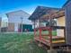 Wooden shed with covered deck in the backyard at 206 King Henry Ln, Gastonia, NC 28056