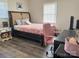 Bedroom with a queen-size bed, nightstand, and a workspace at 206 King Henry Ln, Gastonia, NC 28056