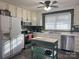 Well-equipped kitchen with white cabinets and stainless steel appliances at 206 King Henry Ln, Gastonia, NC 28056