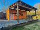 Covered outdoor storage container with a wooden awning at 206 King Henry Ln, Gastonia, NC 28056