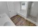 Elegant bathroom with a soaking tub, shower, and double vanity at 2115 Windy Hill Ln, Monroe, NC 28110