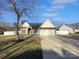 House exterior with a two-car garage and manicured lawn at 2115 Windy Hill Ln, Monroe, NC 28110