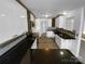 Modern kitchen with dark countertops and white cabinets at 2115 Windy Hill Ln, Monroe, NC 28110