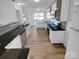 Modern kitchen with dark countertops and white cabinets at 2115 Windy Hill Ln, Monroe, NC 28110