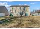 Backyard view of house with patio and grass at 2224 Apple Glen Ln, Charlotte, NC 28269