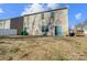 Backyard view of house with patio and grass at 2224 Apple Glen Ln, Charlotte, NC 28269