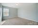 Bright bedroom with carpeted floor and window at 2224 Apple Glen Ln, Charlotte, NC 28269