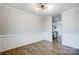 Bright dining room with hardwood floors and wainscoting at 2224 Apple Glen Ln, Charlotte, NC 28269