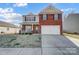 Two-story brick home with a two-car garage and manicured lawn at 2224 Apple Glen Ln, Charlotte, NC 28269