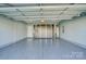 Finished two-car garage with epoxy flooring and storage cabinets at 2224 Apple Glen Ln, Charlotte, NC 28269