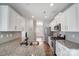 Modern kitchen with granite countertops, white cabinets, and stainless steel appliances at 2224 Apple Glen Ln, Charlotte, NC 28269