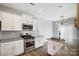 Kitchen with granite countertops, white cabinets, and stainless steel appliances at 2224 Apple Glen Ln, Charlotte, NC 28269