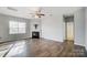 Living room with hardwood floors, fireplace, and access to a bathroom at 2224 Apple Glen Ln, Charlotte, NC 28269