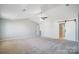 Main bedroom with vaulted ceiling, carpet, and barn door at 2224 Apple Glen Ln, Charlotte, NC 28269