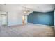 Main bedroom with vaulted ceiling, accent wall, and barn door at 2224 Apple Glen Ln, Charlotte, NC 28269