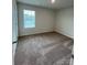 Bright bedroom featuring neutral walls and carpeted floors at 2255 Transatlantic Ave, Charlotte, NC 28215