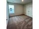 Well-lit bedroom with neutral walls and double doors at 2255 Transatlantic Ave, Charlotte, NC 28215