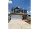 Two-story house with a neutral color scheme and a two-car garage at 2255 Transatlantic Ave, Charlotte, NC 28215