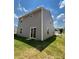 Side view of a two-story house with vinyl siding and a sliding glass door at 2255 Transatlantic Ave, Charlotte, NC 28215