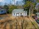 House with a gray exterior and nicely landscaped yard at 2516 Columbus Cir, Charlotte, NC 28208