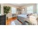 Bright bedroom with hardwood floors, neutral walls, and bright windows providing natural light at 2516 Columbus Cir, Charlotte, NC 28208