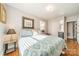 Spacious bedroom with ample natural light and hardwood floors at 2516 Columbus Cir, Charlotte, NC 28208