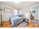 Serene bedroom with full-size bed and hardwood floors at 2516 Columbus Cir, Charlotte, NC 28208