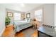 Bright bedroom featuring a comfortable bed and hardwood floors at 2516 Columbus Cir, Charlotte, NC 28208