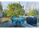 Wooden deck with patio furniture and grill at 2516 Columbus Cir, Charlotte, NC 28208