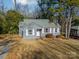 Gray house with white trim and a small yard at 2516 Columbus Cir, Charlotte, NC 28208