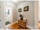 Neat hallway with built-in storage and hardwood floors at 2516 Columbus Cir, Charlotte, NC 28208