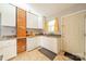 Kitchen with white cabinets, granite counters and breakfast table at 2516 Columbus Cir, Charlotte, NC 28208