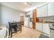 Kitchen with white cabinets, granite counters, and breakfast table at 2516 Columbus Cir, Charlotte, NC 28208