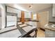 Kitchen with white cabinets, granite counters, and breakfast table at 2516 Columbus Cir, Charlotte, NC 28208