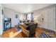 Living room with couches, coffee table, and hardwood floors at 2516 Columbus Cir, Charlotte, NC 28208