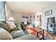 Living room with couches, coffee table, and kitchen view at 2516 Columbus Cir, Charlotte, NC 28208