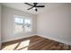 Well-lit bedroom with wood-look floors and large window at 2572 Maiden-Salem Road Maiden Salem Rd # 4, Lincolnton, NC 28092