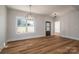 Bright dining room features hardwood floors and a modern chandelier at 2572 Maiden-Salem Road Maiden Salem Rd # 4, Lincolnton, NC 28092